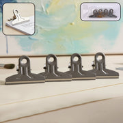 Heavy duty metal paper clamp clips holding documents tightly