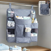 Hanging baby organizer with multiple pockets for diapers and clothes