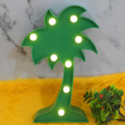 The Coconut Tree LED Lamp placed on a table, creating a romantic atmosphere in a home setting.