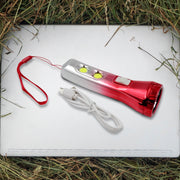 Portable LED torchlight resting on a flat surface, ready for use.