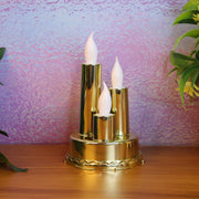 Golden LED flameless candle lamp with triple candle design glowing softly