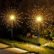 Decorative solar firework LED garden lights illuminating outdoor space
