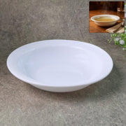Deep round white curry bowl with glossy finish on white background