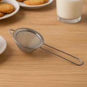 Stainless steel fine mesh strainer with slim ergonomic handle for kitchen use