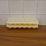 Easy release silicone ice cube maker with 24 compartments and lid.