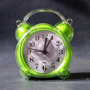 Analog alarm clock showing precise time with clear hour and minute hands