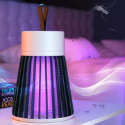 A white and black Mosquito Killer Lamp with purple light sits on a nightstand with a subtle mosquito graphic.