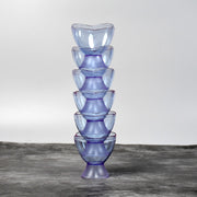 Clear plastic dessert bowls filled with delicious treats for home use.