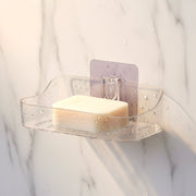 Two clear plastic transparent soap holders side by side for bathroom storage
