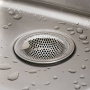 Stainless steel catcher strainer placed in kitchen sink drain opening