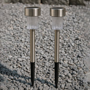 Weatherproof solar path light standing in a garden with green foliage
