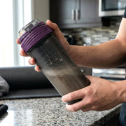 Protein shaker bottle featuring a screw-on cap for secure closure