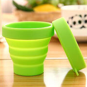 Round foldable silicone travel mug with a secure, leakproof lid.