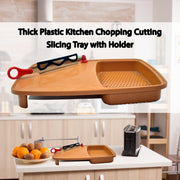 Plastic chopping board with a corner holder, ideal for collecting sliced vegetables.