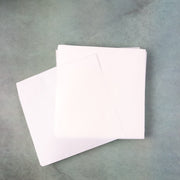 Stack of white, grease-resistant non-stick food paper sheets, size 220x220 mm
