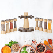 A cook using the 360° rotating kitchen spice rack to season a dish.