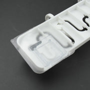 Pack of adjustable wall hooks ready for home installation.