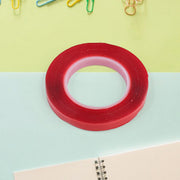 Close-up texture of acrylic foam mounting tape showing strong adhesive surface