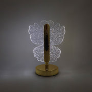 Decorative crystal table lamp emitting warm LED light