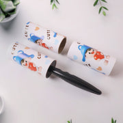 Hand holding lint roller rolling over clothes to remove lint and dust