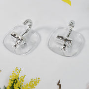 Strong plastic self adhesive wall hooks fixed on kitchen backsplash