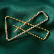 Crystal embellished golden brooch pin securing saree pleats