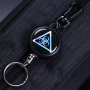 Retractor key chain with steel cable, showcasing its robust build quality.
