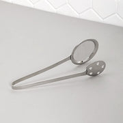Polished steel serving tong with dual mesh and perforated sides for draining food