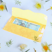 A neat stack of multicoloured premium cash gift envelopes with elegant purse handles.