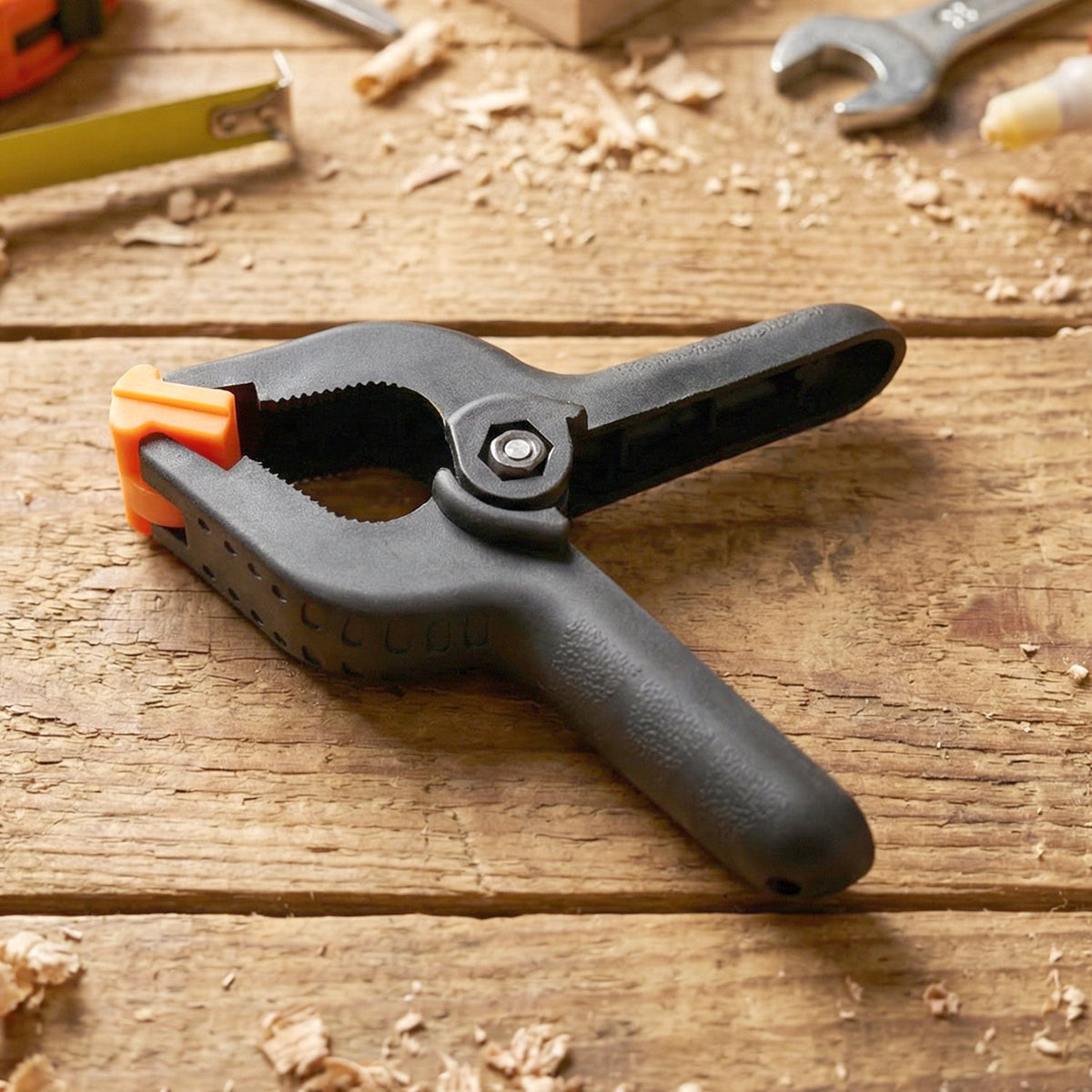 Spring clamp held in hand demonstrating one hand operation ease