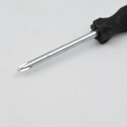 Set of small tools including the XcelGrip Phillips screwdriver.