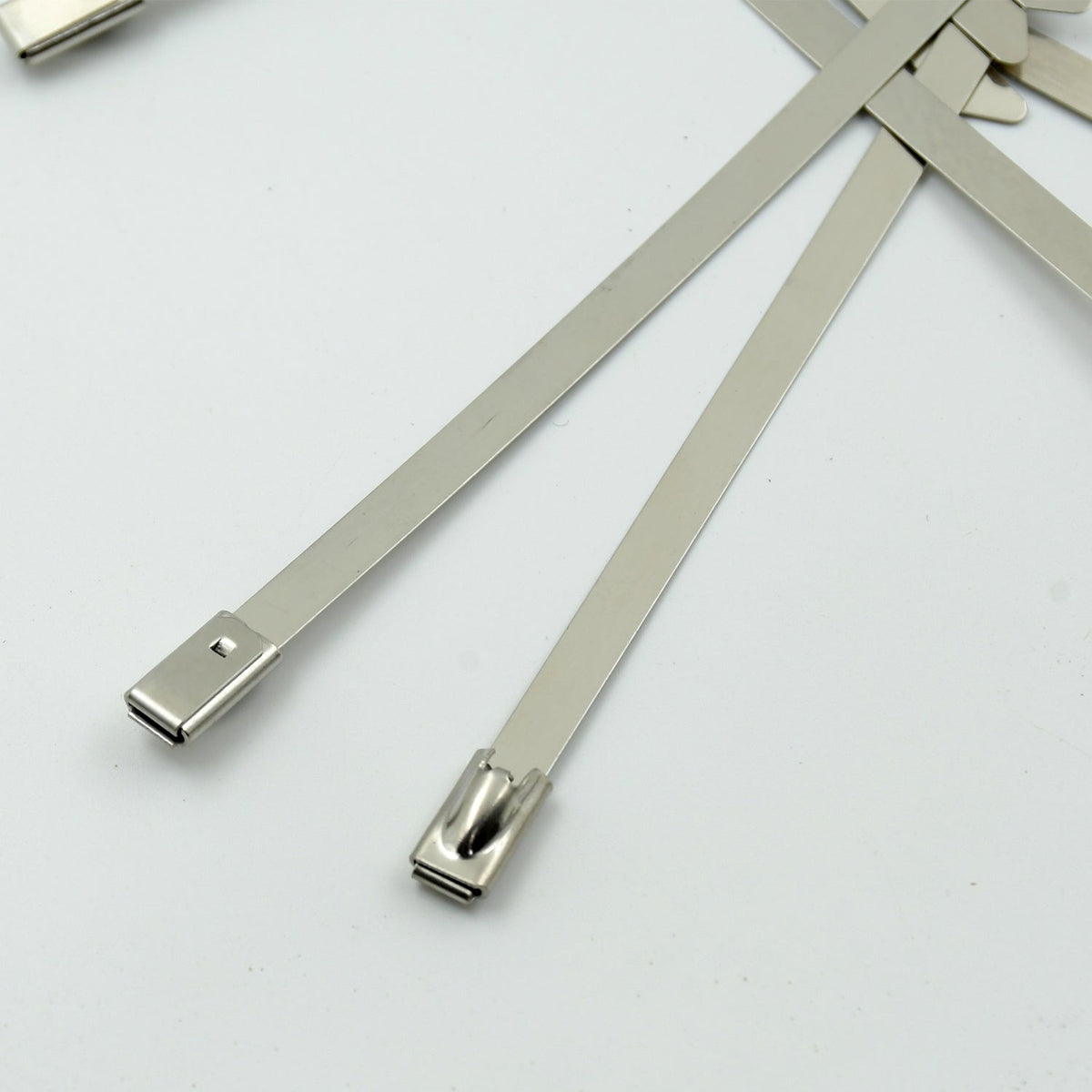 WipeTech's corrosion-resistant stainless steel cable fasteners against a metallic background.