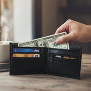 Close-up showing stitched edges and compartments of classic bi-fold wallet