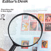 Side view of the ergonomic handle and 50mm glass lens of the reading magnifier.