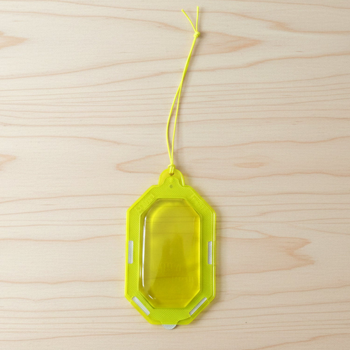 Hanging citrus gel air freshener on a towel rod