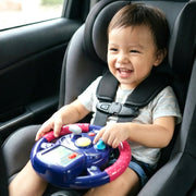 Close-up of child-friendly steering wheel toy featuring bright lights
