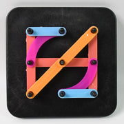 Brightly coloured alphabet numeric puzzle pieces arranged in a grid pattern.
