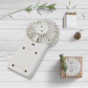 Close-up of the simple one-button control on the portable personal fan.