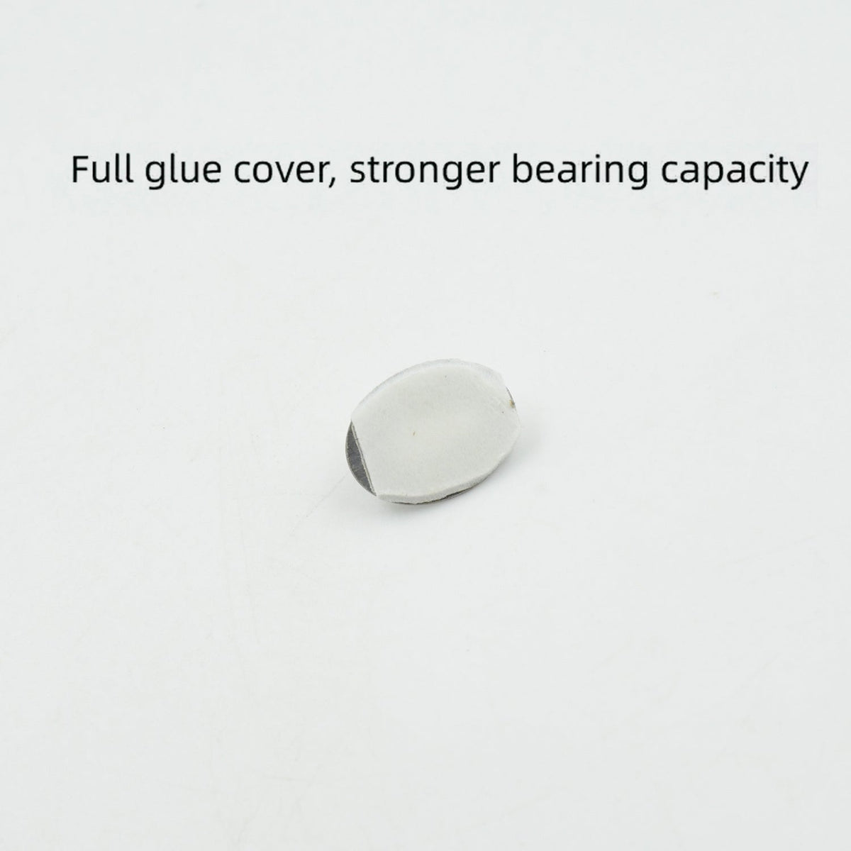 A single capsule-shaped stainless steel hook demonstrating its strong adhesive backing.