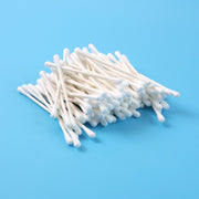 Close-up of cotton swabs highlighting paper stick stems for grooming