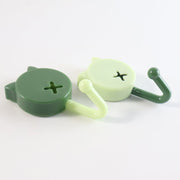 Sticky adhesive base of self adhesive round wall hooks showing strong adhesive pad