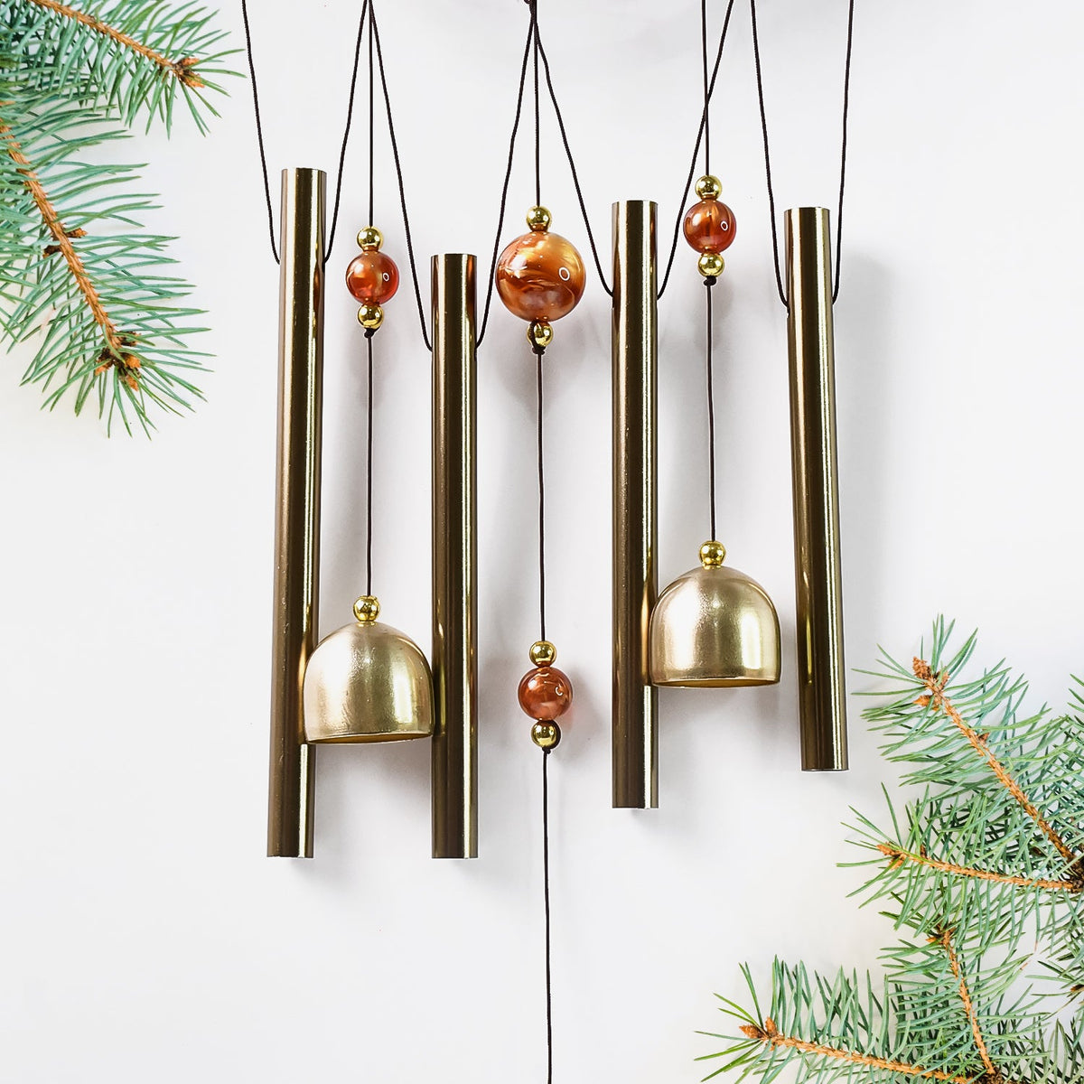 Lord Ganesh Wind Chimes displayed in garden setting creating peaceful ambiance