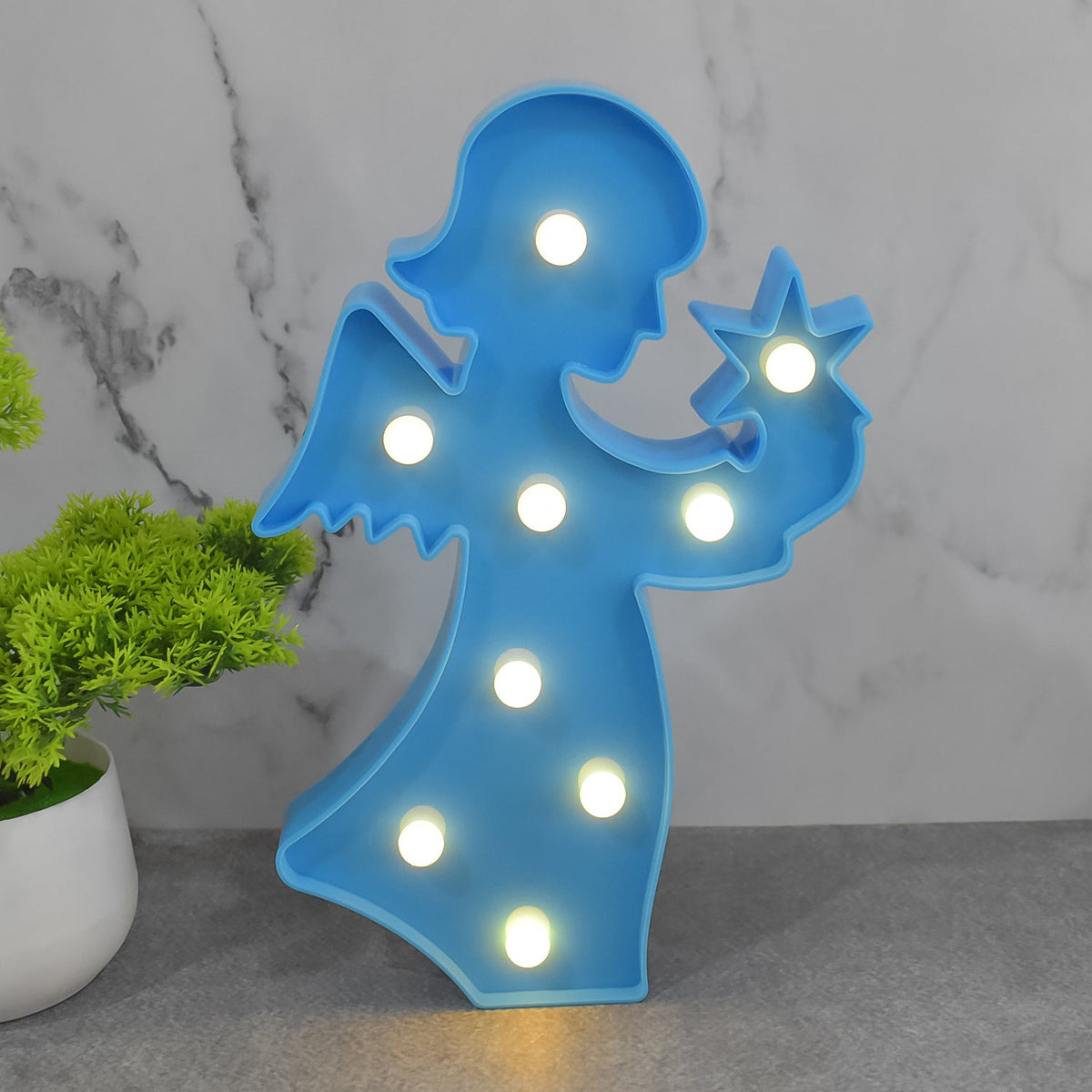 Decorative LED angel lamp on a bedside table, ideal as a thoughtful gift for girls.