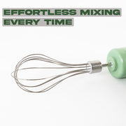 Close-up of the powerful motor and detachable stainless-steel whisk attachment.