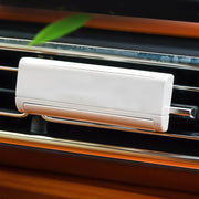 Car interior ambience with solar-powered air freshener releasing scent