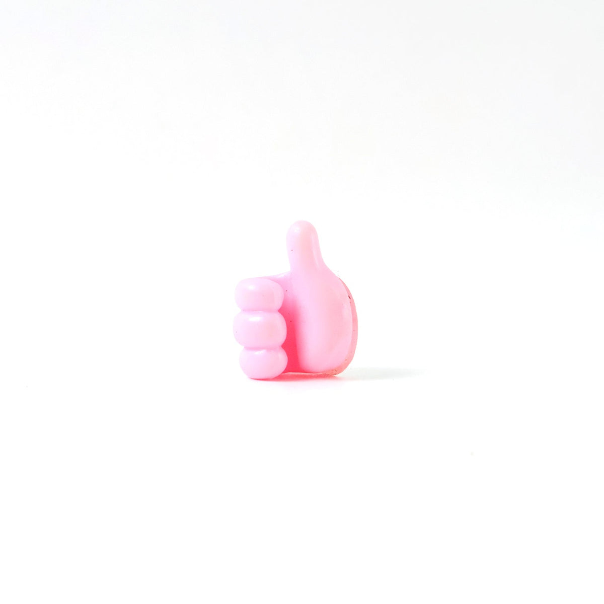 Side profile of pink silicone hand clip wall holder for organizing cables