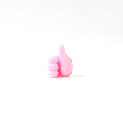 Side profile of pink silicone hand clip wall holder for organizing cables