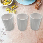 Side view of a single unbreakable plastic tea cup on a clean background.