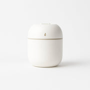 Mini USB Humidifier releasing a visible cool mist plume.