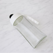 Automatic lid mechanism opening on glass oil bottle dispenser